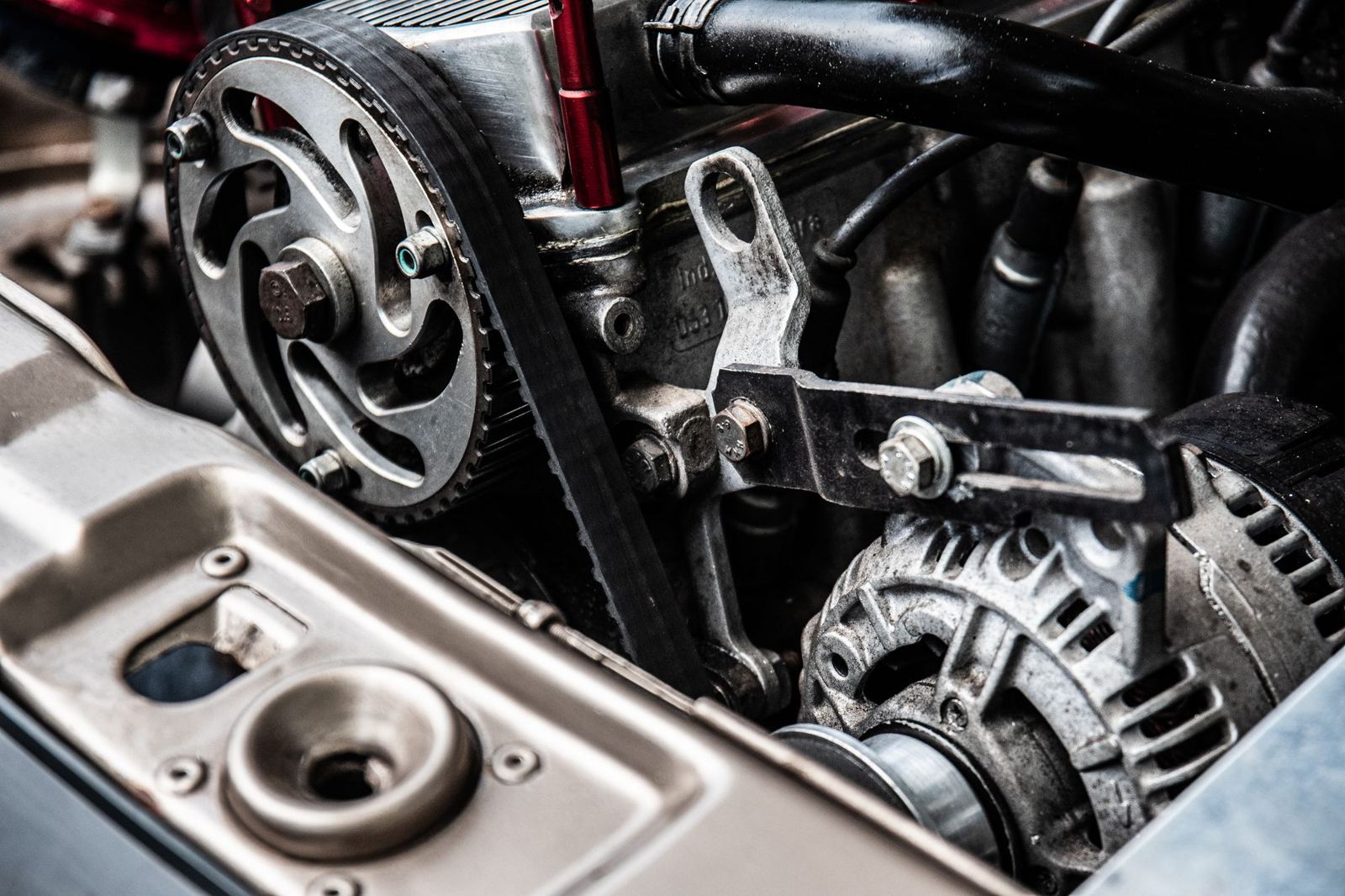 Alternator with belt drive in the engine bay